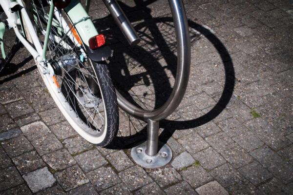 Bike stand with ground anchor bolt